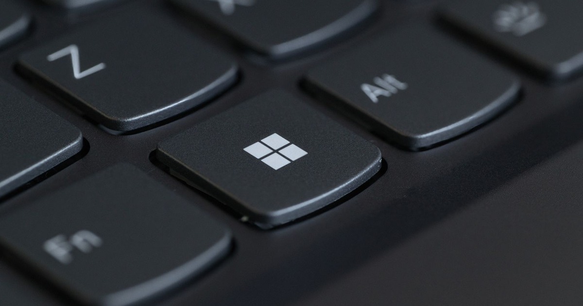Detailed close-up of a computer keyboard featuring the Windows key in focus.